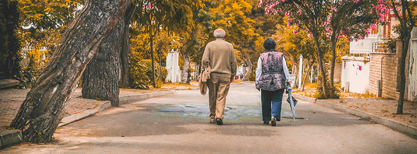 man-and-woman-walking-on-the-street-2385569